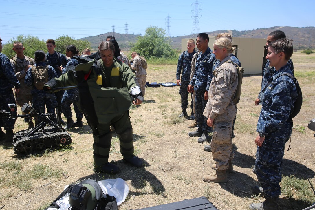 MARINE CORPS BASE CAMP PENDLETON, Calif. - Michelle Mathews and her fellow Midshipmen familiarize themselves with Explosive Ordnance Disposal equipment during a week-long Career Orientation and Training of Midshipmen program at Camp Pendleton June 16, 2016. Mathews strives to become a combat engineer officer. The program allows college students to familiarize themselves with some of the Marine Corps and Navy military operations and tactics. (U.S. Marine Corps Photo by Cpl. Demetrius Morgan/RELEASED)