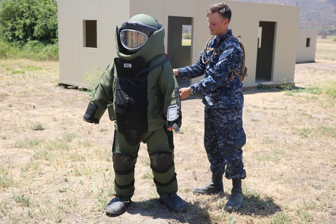 MARINE CORPS BASE CAMP PENDLETON, Calif. – Midshipman Michelle Mathews tests the Explosive Ordnance Disposal bomb suit during a week-long Career Orientation and Training of Midshipmen program at Camp Pendleton June 16, 2016. Mathews is a 19-year-old college student attending Villanova University. Throughout the training, Mathews and her fellow Midshipmen experience various perspectives of Marine Corps and Navy war fighting capabilities.  (U.S. Marine Corps Photo by Cpl. Demetrius Morgan/RELEASED)