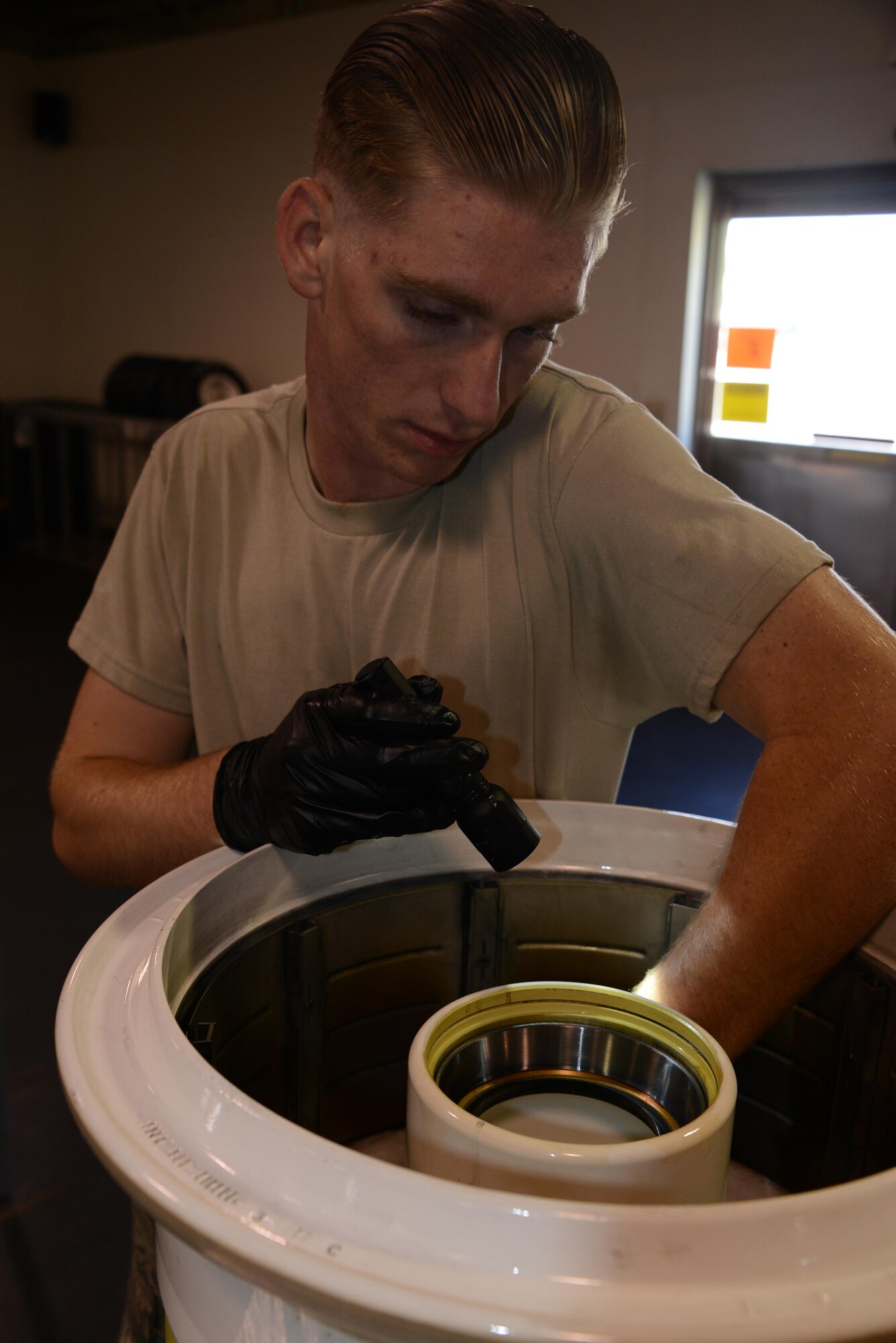 Airman 1st Class Dakota Lanning, 56th Equipment Maintenance Squadron wheel and tire team member, inspects the drive keys, heat shields and bearing cups on an F-35 wheel June 15, 2015, at Luke Air Force Base, Ariz. The wheel and tire section is responsible for disassembling, inspecting, repairing, assembling and servicing wheels for 43 F-35 Lightning II aircraft and 71 F-16 Fighting Falcon aircraft. (U.S. Air Force photo by Tech. Sgt. Timothy Boyer)