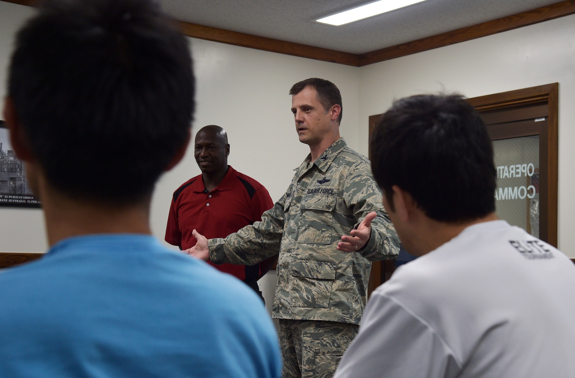 U.S. Air Force Col. William Bowman, the commander of the 35th Operations Group, speaks with members of the Japan Railway East Akita Peckers basketball team at Misawa Air Base, Japan, June 17, 2016. As part of a Misawa AB tour and basketball camp, the Japanese team was briefed on the purpose and mission of the 35th Fighter Wing. The goal of the event was to promote bilateral relations and help basketball players prepare for the upcoming season. (U.S. Air Force photo by Senior Airman Deana Heitzman)