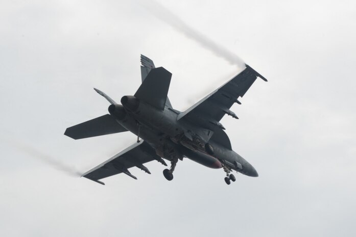 160615-N-GZ947-022: PHILIPPINE SEA (June 15, 2016) - An F/A-18F Super Hornet assigned to the Black Aces of Strike Fighter Squadron (VFA) 41 flies over USS John C. Stennis' (CVN 74) during Malabar 2016. A trilateral maritime exercise, Malabar is designed to enhance dynamic cooperation between the Indian Navy, Japanese Maritime Self-Defense Force (JMSDF) and U.S. Navy forces in the Indo-Asia-Pacific. (U.S. Navy photo by Mass Communication Specialist 3rd Class Kenneth Rodriguez Santiago / Released)
