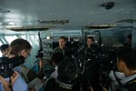 160615-N-MY174-189 PHILIPPINE SEA (June 15, 2016) - Visiting media interview Rear Adm. Marcus Hitchcock, commander, John C. Stennis Strike Group, and Capt. Greg Huffman, USS John C. Stennis' (CVN 74) commanding officer, on the flag bridge during Malabar 2016. Twenty-one members of international media came aboard to learn about carrier operations. A trilateral maritime exercise, Malabar is designed to enhance dynamic cooperation between the Indian Navy, Japanese Maritime Self-Defense Force (JMSDF) and U.S. Navy forces in the Indo-Asia-Pacific. (U.S. Navy photo by Mass Communication Specialist 3rd Class Tomas Compian/Released)