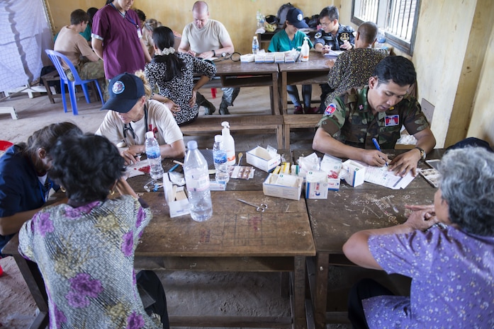 Royal Cambodian Armed Forces medical professionals work as a team alongside U.S. Armed Forces medical professionals to provide care to patients during Pacific Angel 16-2, June 14, 2016, in Kampot Province, Cambodia. The Pacific Angel 16-2 medical team is made up of military health practitioners from the Cambodia Armed Forces, U.S. Armed Forces, Thai Royal Air Force, Australian Royal Air Force and Vietnamese Royal Air Force. Non-governmental organizations such as Project Hope and East Meets West also helped by supplying translators and medics as well.  The U.S. military seeks opportunities to strengthen its relationship with other nations’ militaries through activities such as subject-matter expert exchanges, host nation visits, and bilateral engagements. (U.S. Air Force photo by Senior Airman Omari Bernard/released)