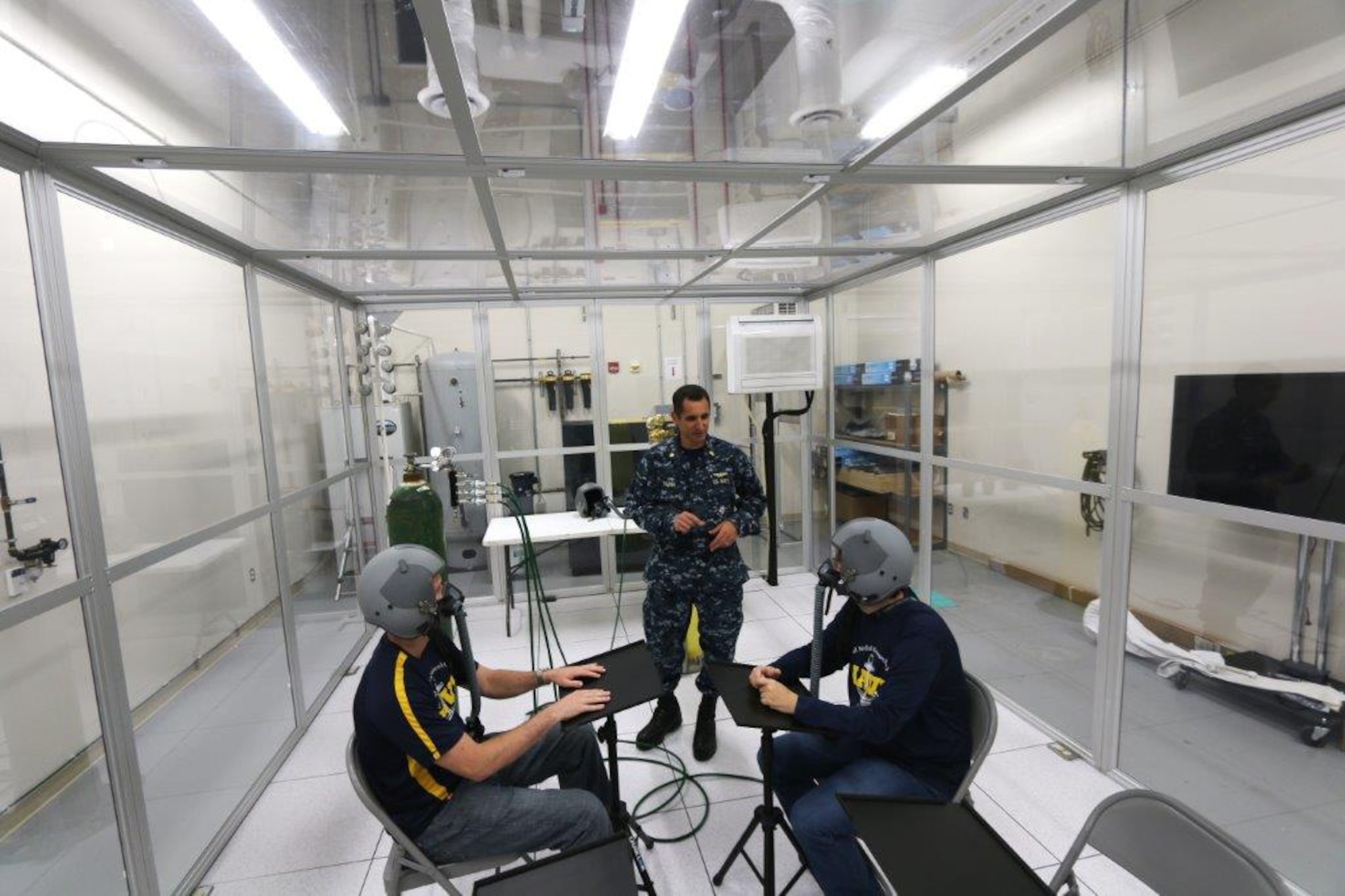 The Reduced Oxygen Breathing Environment at Naval Medical Research Unit Dayton is used by their Hypoxia Countermeasures Research Team. The
team investigates hypoxia sensor evaluation, tactical aviation oxygen delivery schedule, and hypoxia biomarkers. NARMU-D researchers collaborate with 711th Human Performance Wing researchers to evaluate several off the shelf sensor suites for in-flight hypoxia detection. (Courtesy photo)