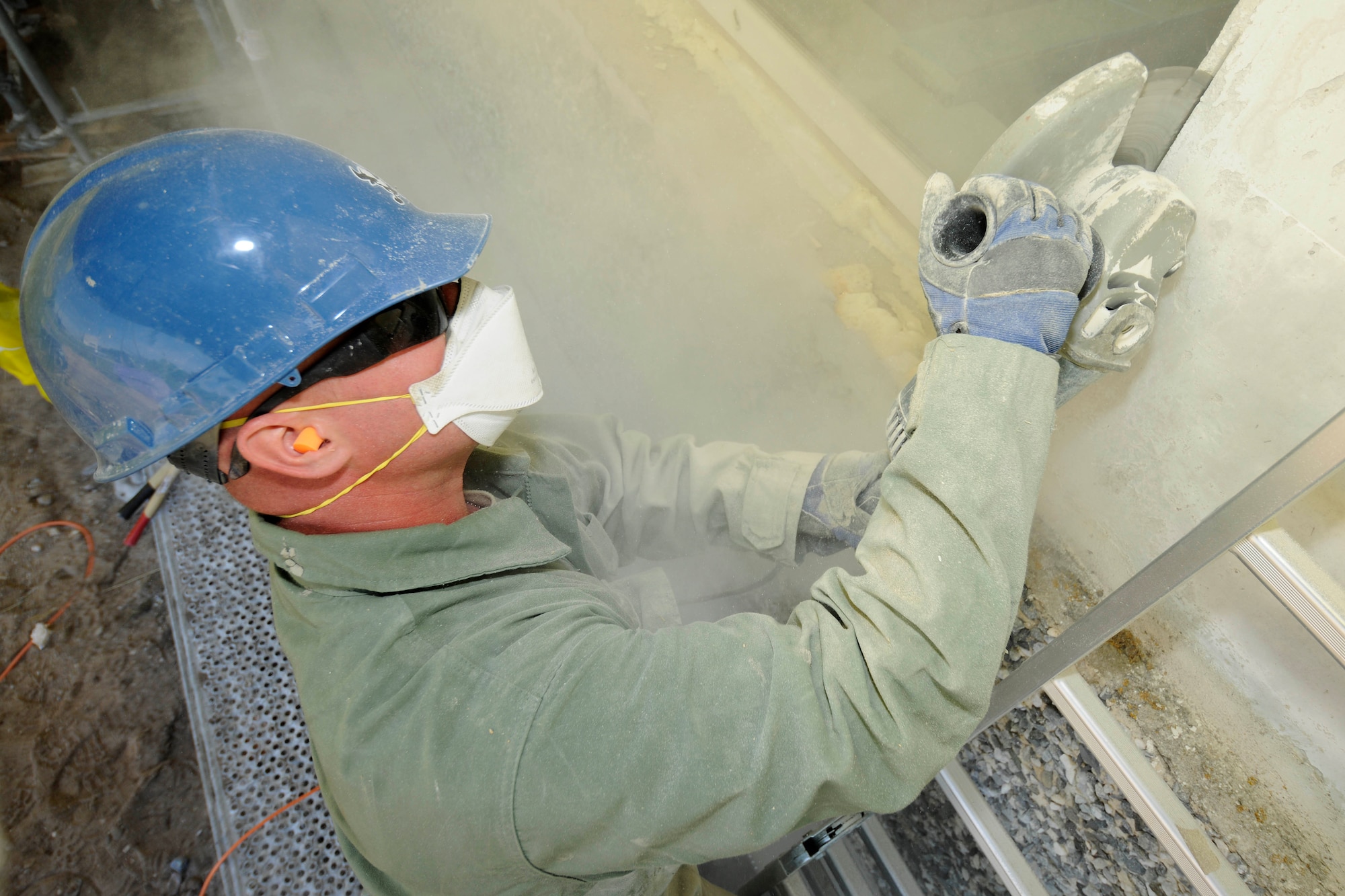 Tech. Sgt. Derek Leppek, 127th Civil Engineering Squadron structures supervisor, cuts into the concrete around a window of a kindergarten school in Silmala, Latvia on June 19, 2016. The school is undergoing construction as part of the U.S. European Command’s Humanitarian Civic-Assistance project. United States and Latvian military engineers are working together to complete the project. (U.S. Air National Guard photo by Senior Airman Ryan Zeski)