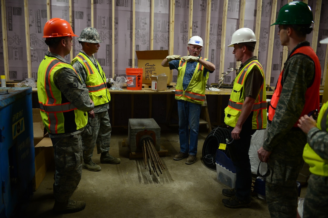 Hank Cook, Cianbro Corporation construction manager for the Sarah Mildred Long replacement project, discusses the building process with members from Pease Air National Guard Base at Portsmouth, New Hampshire June 16. (Air National Guard Photo by Airman 1st Class Ashlyn J. Correia)