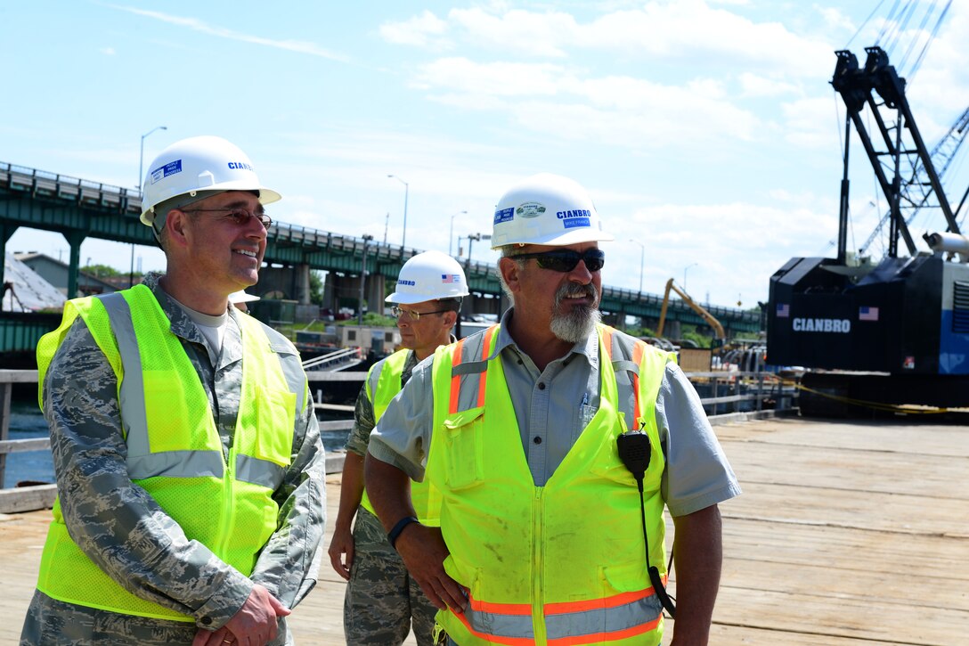 Col. Paul Loiselle, 157th Mission Support Group commander, and Mike Franck, Safety Manager at Cianbro Corporation, review the progress of the Sarah Mildred Long replacement project in Portsmouth, New Hampshire June 16. (Air National Guard Photo by Airman 1st Class Ashlyn J. Correia)