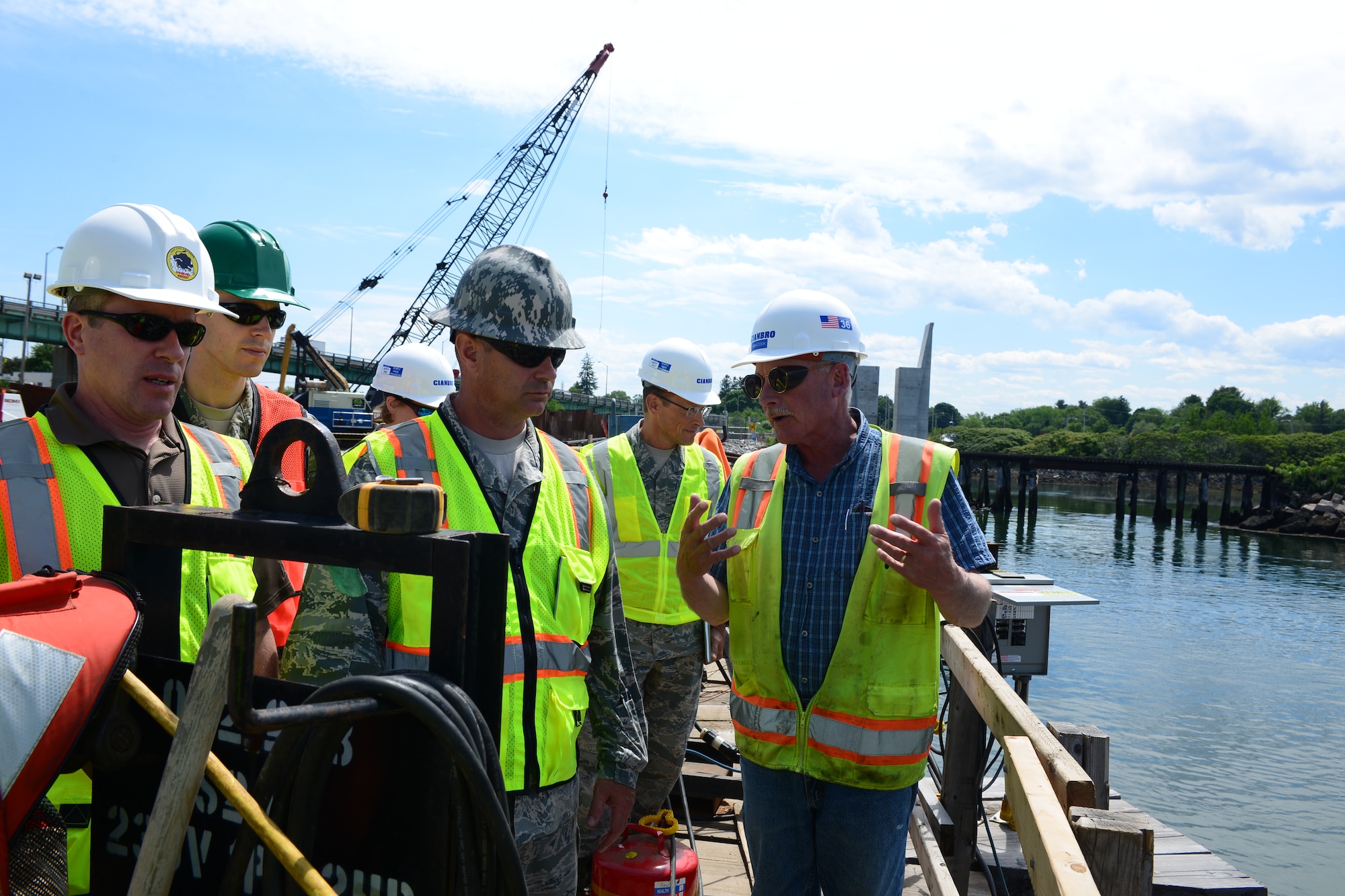 Hank Cook, Cianbro Corporation construction manager for the Sarah Mildred Long replacement project, discusses the building process with Lt. Col. Eugene Mozzoni, 157th Civil Engineering Squadron commander at Portsmouth, New Hampshire June 16. (Air National Guard Photo by Airman 1st Class Ashlyn J. Correia)