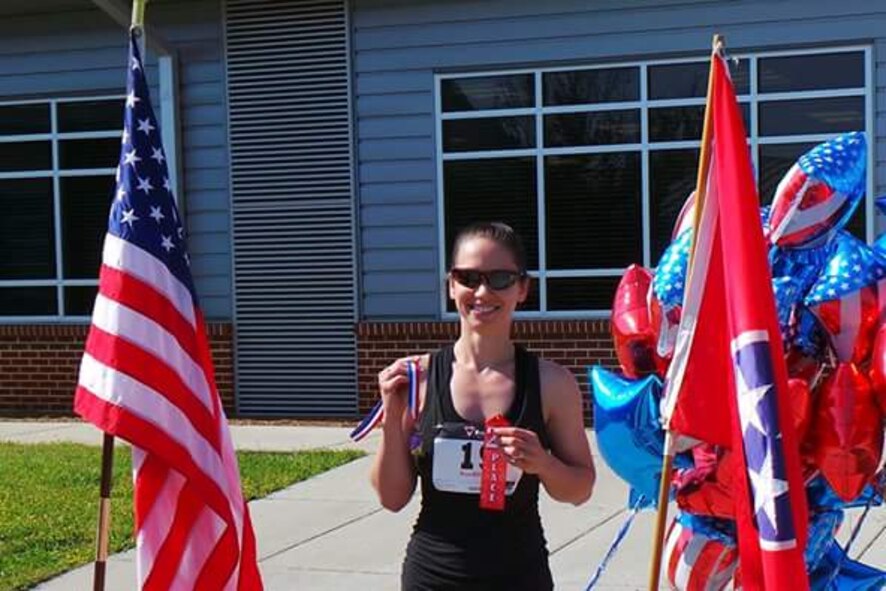 In her spare time outside of working as a software engineer at AEDC, Ginny Burns can be found on a run or in the gym lifting weights in preparation for her next fitness competition. Burns is pictured here after a 5K she ran in Manchester with her family. (Courtesy photo)