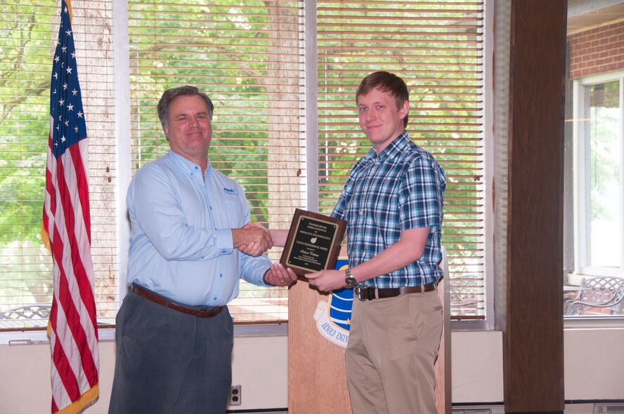 Andrew Redmon (right), with AEDC, receives the AIAA Tennessee Section Young Professional Award from Dr. Joe Sheeley, with AEDC and AIAA Tennessee Section Chair, for his work as the Section Student Branch Liaison and as organizer of the Section’s Paper Seminar. (U.S. Air Force photos/Holly Peterson)

