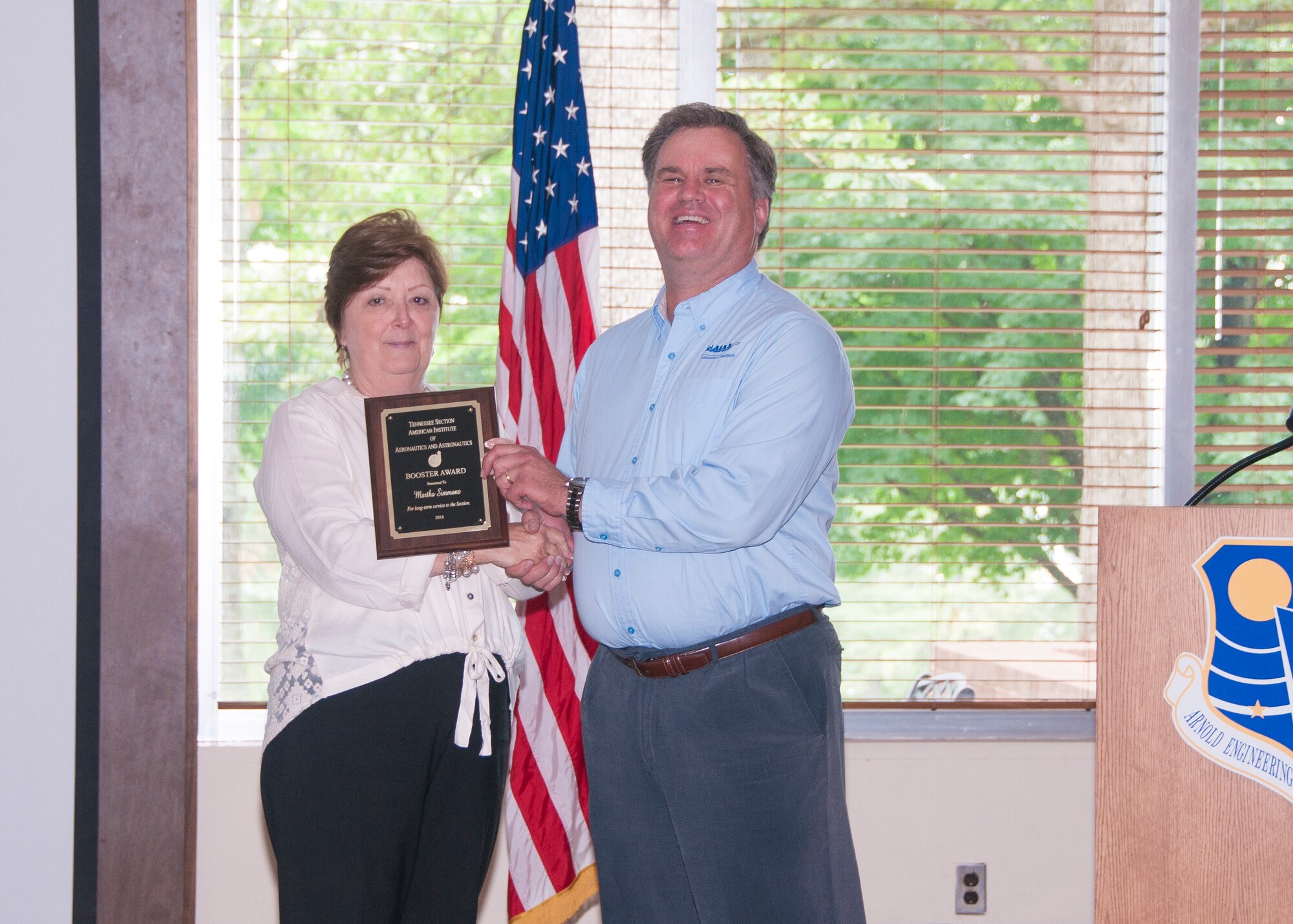 Martha Simmons (left), with AEDC, receives an AIAA Booster Award from Dr. Joe Sheeley, with AEDC and AIAA Tennessee Section Chair, for long-term service to the Section. (U.S. Air Force photos/Holly Peterson)

