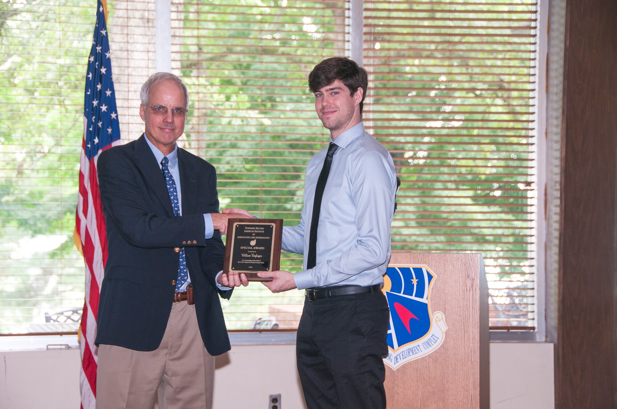 William Emfinger (right), from Vanderbilt University, receives an AIAA Special Award from Professor Bob Pitz, VU Mechanical Engineering Department, for outstanding mentorship of the 2014-2015 Vanderbilt Student Launch Team. (U.S. Air Force photos/Holly Peterson)