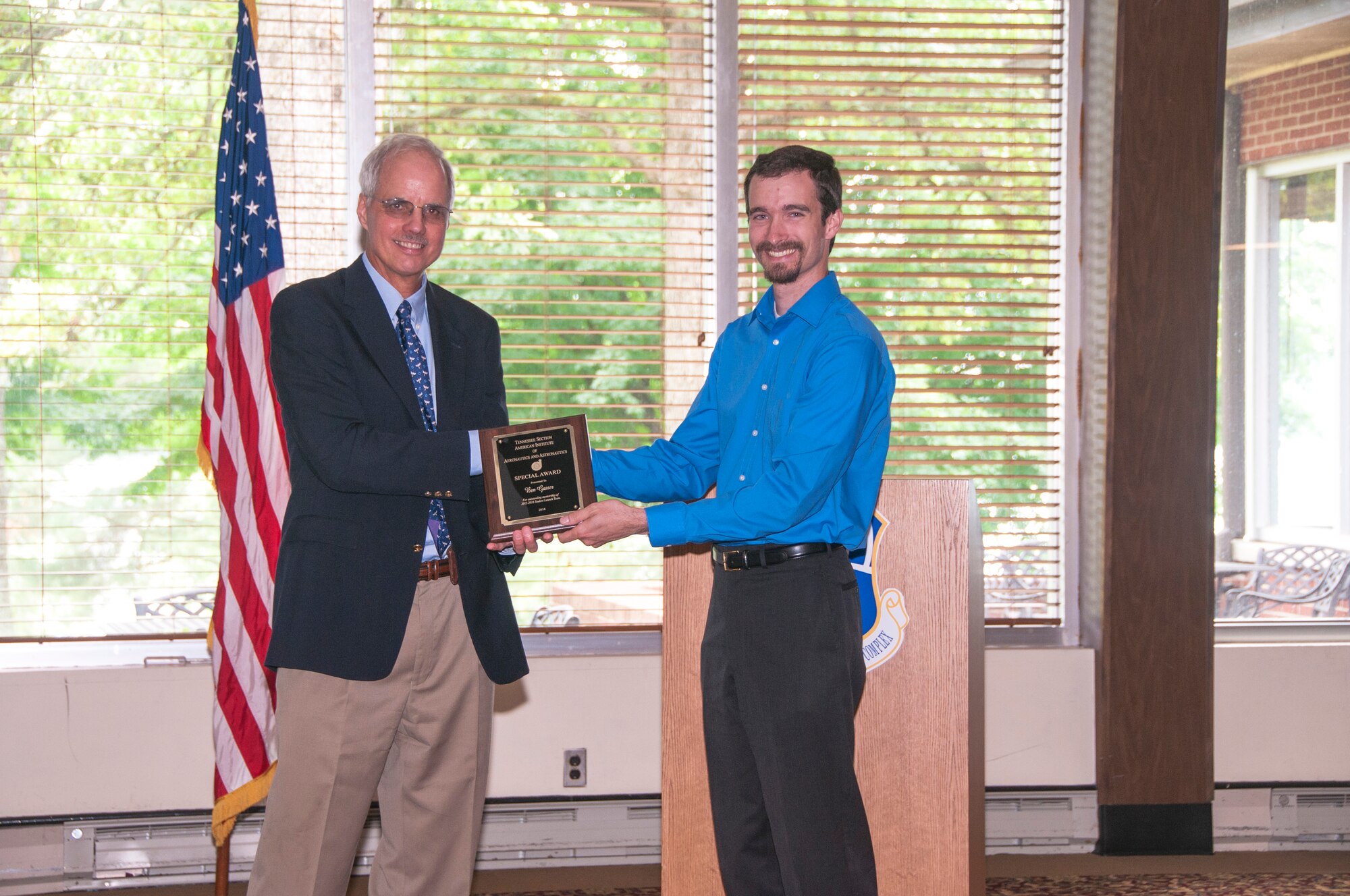 Ben Gasser (right), from Vanderbilt University, receives an AIAA Special Award from Professor Bob Pitz, VU Mechanical Engineering Department, for outstanding mentorship of the 2015-2016 Student Launch Team. (U.S. Air Force photos/Holly Peterson)