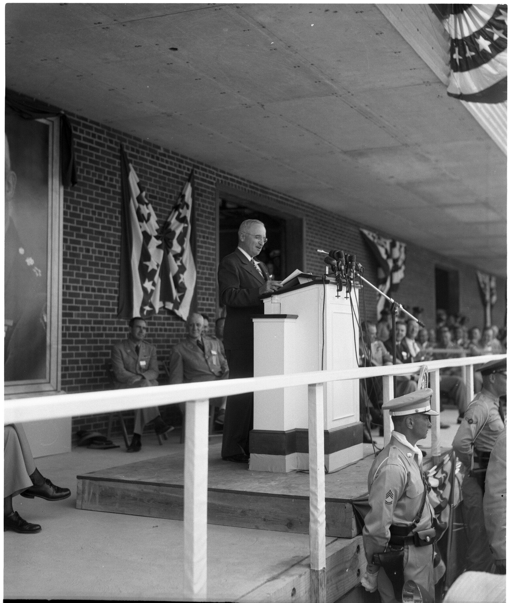 President Harry Truman delivers the dedication speech at the Arnold Engineering Development Complex in 1951. The President dedicated the new Air Engineering Development Center as the then Arnold Engineering Development center in memory of General of the Air Force Henry “Hap” Arnold. Arnold had pushed for the establishment of the test complex so that America would never lag behind in aerospace testing again. President Truman said in his address that “here men would explore flight beyond the speed of sound.” Mrs. Arnold, her sons, then Air Force Chief of Staff Gen. Hoyt S. Vandenberg and thousands of guests braved the unseasonable heat and dust to attend the ceremony. (AEDC file photo)