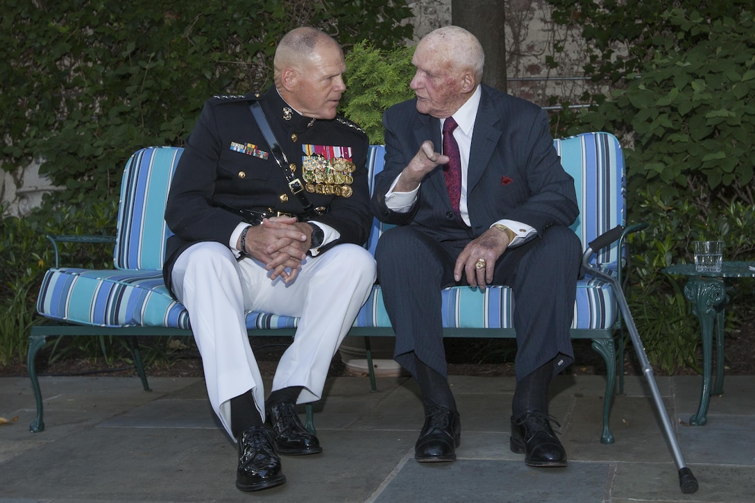 Marine Corps Gen. Robert B. Neller, left, commandant of the Marine Corps, speaks to retired Gunnery Sgt. Gardner Brown, World War II veteran, during the evening parade reception at the Home of the Commandants, Washington, D.C., June 17, 2016. Evening parades are held as a means of honoring senior officials, distinguished citizens and supporters of the Marine Corps. (U.S. Marine Corps photo by Cpl. Samantha K. Draughon/Released)
