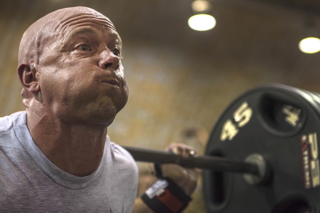 Air Force Capt. Benjamin Swope competes in the squat portion of Bagram’s Strongest Women and Men’s competition at Bagram Airfield, Afghanistan, June 18, 2016. Swope, assigned to the 455th Expeditionary Security Forces Squadron, was was the overall winner in the men's division for the squat, bench and deadlift. Air Force photo by Senior Airman Justyn M. Freeman