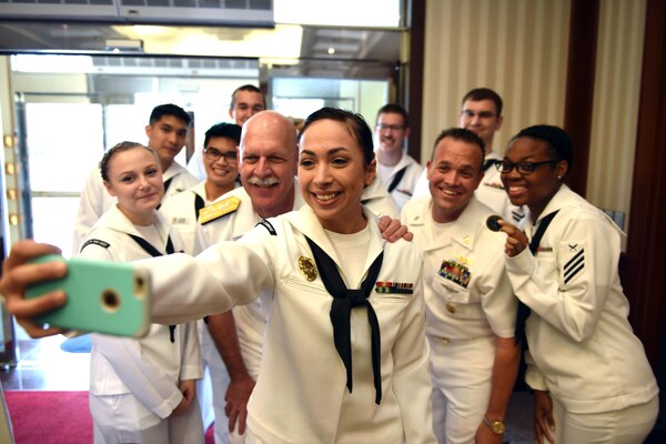 160617-N-WT427-111 JINHAE, Republic of Korea (June 17, 2016) Master-at-Arms Seaman Apprentice Elysia Clark, assigned to Commander, Fleet Activities Chinhae (CFAC), takes a selfie with Adm. Scott H. Swift, the commander of U.S. Pacific Fleet, during his visit to CFAC in the Republic of Korea, June 17, 2016. Swift is in Korea to reaffirm the U.S. and ROK alliance and show his support for Sailors serving throughout the peninsula. (U.S. Navy photo by Mass Communication Specialist 3rd Class Jermaine M. Ralliford)