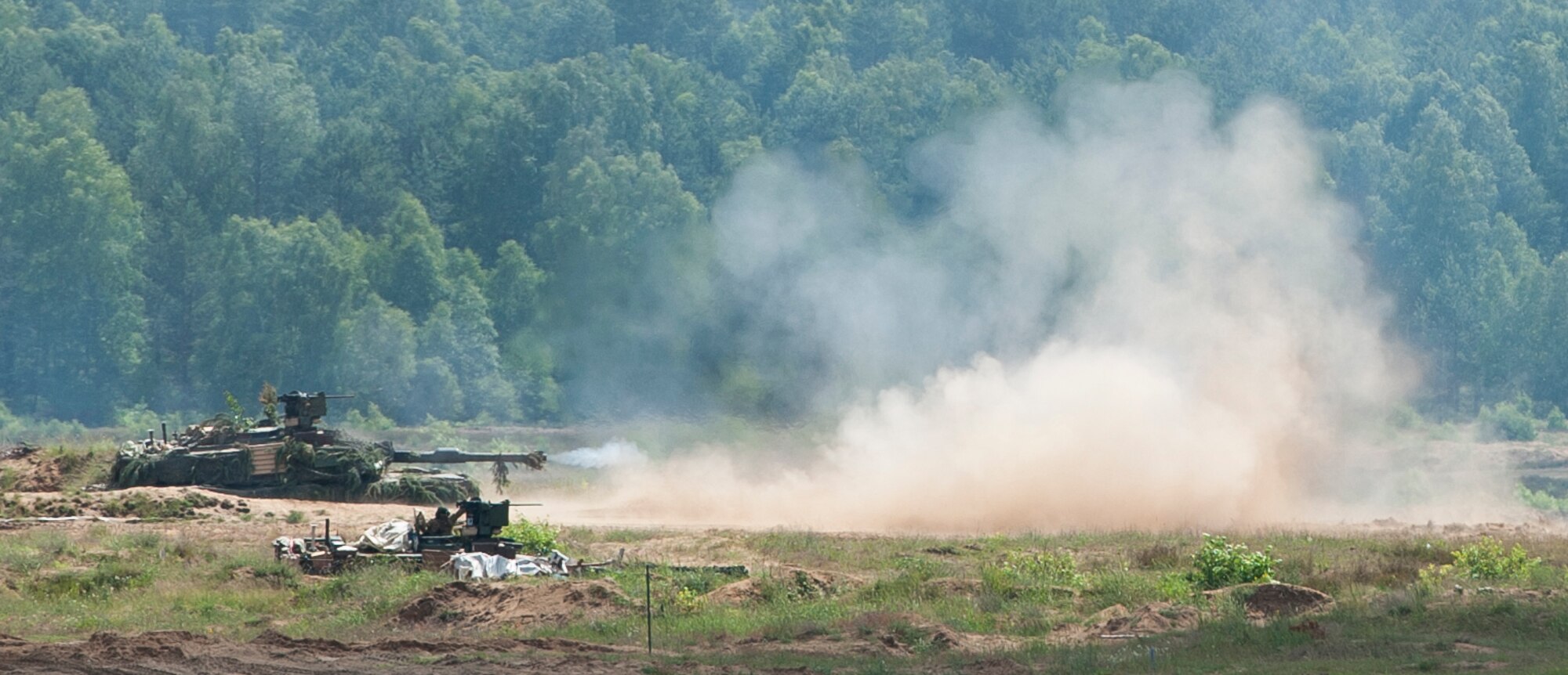 An M1 Abrams tank fires a round as part of a live-fire event during exercise Anakonda 2016 June 16, 2016, in Poland. The event was an opportunity for U.S. Airmen to train alongside allies and test aircraft, vehicles and other equipment in a live fire exercise. The event served as a wrap up for Anakonda 2016, a Polish-led international exercise that aimed to train, exercise and integrate Poland and its allied forces by demonstrating their defense capabilities to deploy in mass numbers and sustain combat power. (U.S. Air Force photo/Airman 1st Class Lane T. Plummer)
