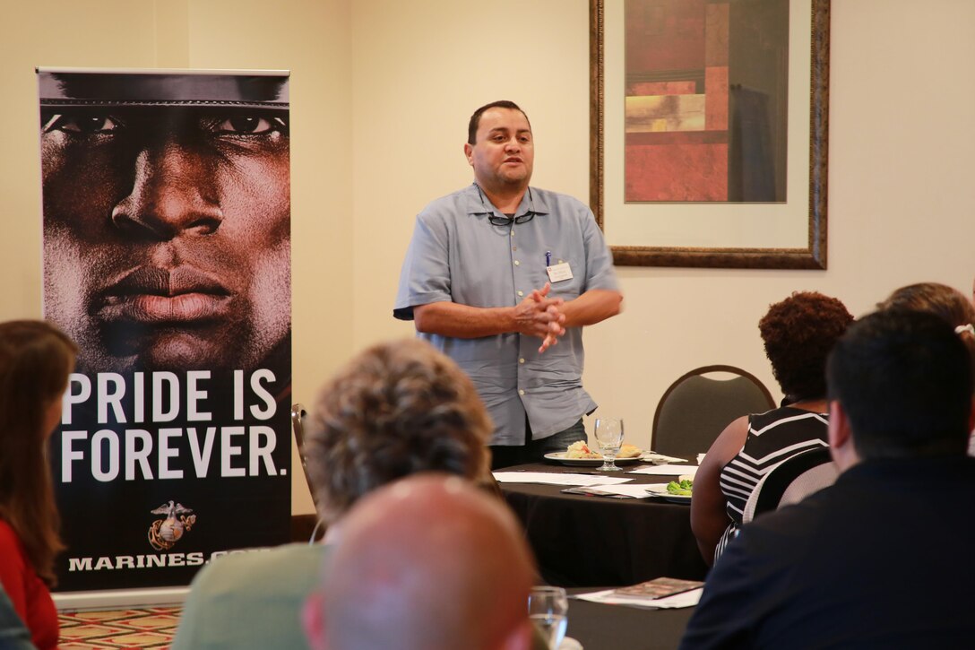 Benjamin Duarte introduces himself as part of a welcome address at the Holiday Inn Express in Dumfries, Va., June 20 for the 2016 Key Leaders and Educators Workshop. Approximately 40 educators from states west of the Mississippi River were welcomed. The workshop includes events such as infantry patrolling, flight simulations and many others in order to provide educators a robust understanding of what goes into making Marine officers. The workshop creates a mutually beneficial relationship between educators and the Marine Corps where key leaders and educators can share knowledge about the Corps to students based on firsthand experience. Duarte is an engineering program director for Chico State University in Chico, Calif.