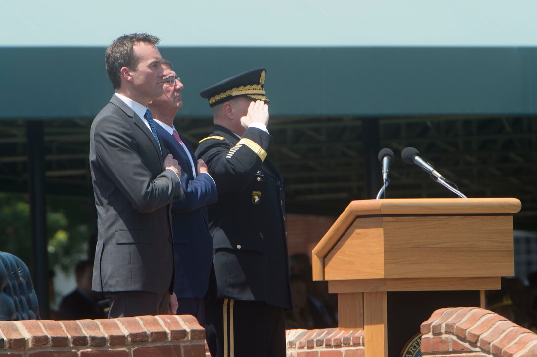 Defense Secretary Ash Carter, center, Army Chief of Staff Gen. Mark Milley, right, and Army Secretary Eric Fanning observe the national anthem during a welcome ceremony for Secretary Fanning at Joint Base Myer-Henderson Hall, Va., June 20, 2016. DoD photo by Navy Petty Officer 1st Class Tim D. Godbee
