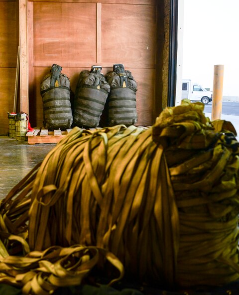 Several packed and unpacked drag parachutes sit inside of the aircrew flight equipment’s building ready for upcoming B-52 Stratofortress missions in support of Operation Inherent Resolve June 15, 2016, at Al Udeid Air Base, Qatar. Airmen who work with B-52 Stratofortress drag chutes go through a two-week training course either at Barksdale Air Force Base, La., or Minot Air Force Base, N.D., to broaden their knowledge of how to successfully perform their detail-oriented task of piecing together parachutes that are used in B-52s. The AFE facility is a large part of the success to making sure each mission has the critical life support and survival equipment needed to handle emergencies and ensure the survival of isolated aircrew. (U.S. Air Force photo/Senior Airman Janelle Patiño/Released)