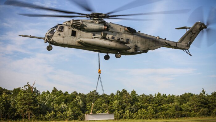 A CH-53E Super Stallion carries an external load during a training exercise at Landing Zone Albatross on Marine Corps Base Camp Lejeune, N.C., June 9, 2016. The purpose of external lifts is to transport large amounts of supplies and heavy gear to areas inaccessible by ground vehicles.