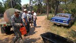 Sgt. Frances Bird Collins, a Soldier with the New Mexico Army National Guard's 1116th Transportation Company, is participating in the water haul mission in support of those residents unable to leave their livestock on the edges of the Dog Head Fire. Even though a mandatory evacuation has been in place for days, some ranchers chose to accept the risk of staying on their land in the affected Torrance County area. The National Guard has been hauling water to some of the tanks and troughs that need to be filled for the welfare of the animals.