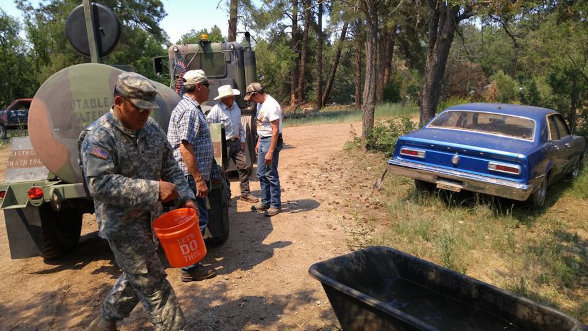 Sgt. Frances Bird Collins, a Soldier with the New Mexico Army National Guard's 1116th Transportation Company, is participating in the water haul mission in support of those residents unable to leave their livestock on the edges of the Dog Head Fire. Even though a mandatory evacuation has been in place for days, some ranchers chose to accept the risk of staying on their land in the affected Torrance County area. The National Guard has been hauling water to some of the tanks and troughs that need to be filled for the welfare of the animals.