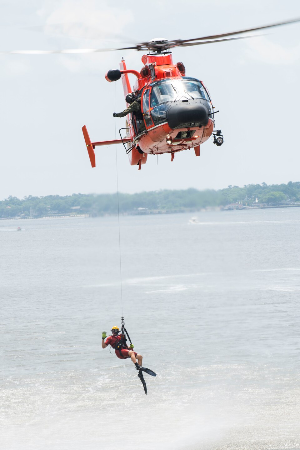 Bobber the Water Safety Dog appeared at Coast Guard Sector Charleston's National Safe Boating Week kickoff event, where he spread the word to children about wearing their life jackets. Here, the Coast Guard demonstrates a water rescue.