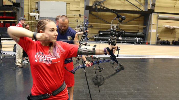 U.S. Marine Corps Veteran Jenna Bisone of Oceanside, California, releases an arrow while practicing archery for competition in the 2016 Department of Defense Warrior Games at the U.S. Military Academy at West Point, New York, June 14, 2016.