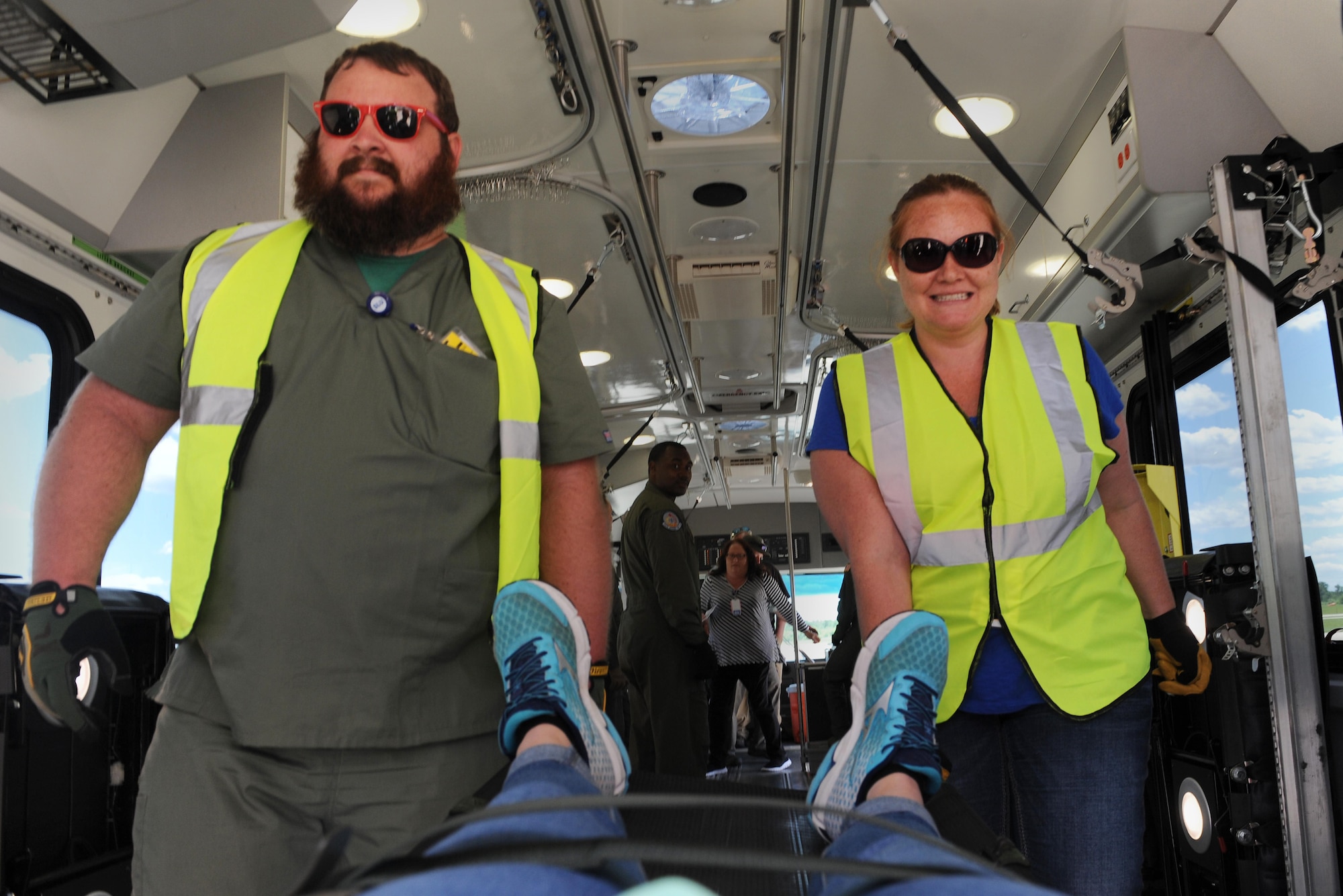 Chris Nation, U.S. Department of Veterans Affairs nuclear medicine technician, and Meghan Leach, DMV polytrauma social worker, practice litter transportation during training June 7, 2016 at the MidAmerica St. Louis Airport in Mascoutah, Illinois. 375th AES servicemembers taught DVA personnel on different types of military equipment, because during natural disasters and emergency situations, DMV and other civilian entities will often work with the military to get patients to safe locations. (U.S. Air Force photo by Staff Sgt. Maria Bowman)