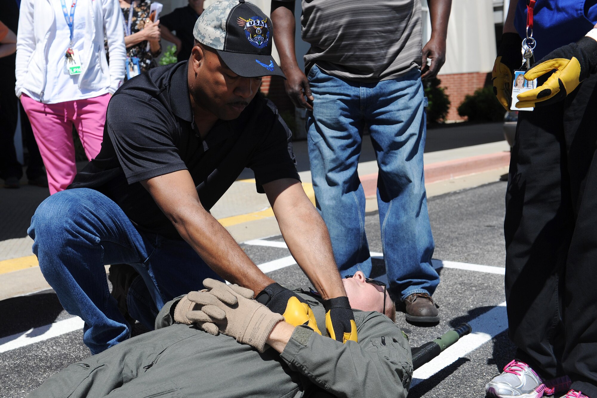 Joseph Randolph, U.S. Department of Veterans Affairs surgical nurse, secures a "patient" during training June 7, 2016 at the MidAmerica St. Louis Airport in Mascoutah, Illinois. Patients must be secured to the litter before transporting them to another location.  (U.S. Air Force photo by Staff Sgt. Maria Bowman)