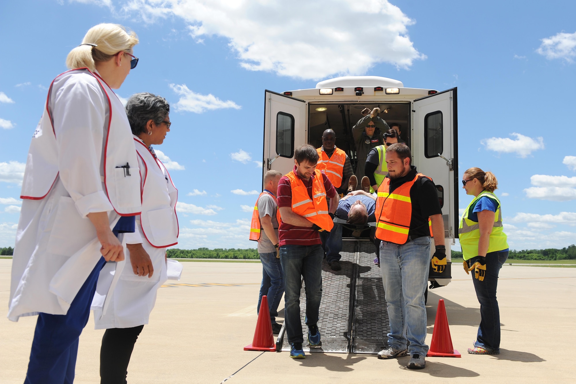 U.S. Department of Veterans Affairs personnel practice litter carries during training June 7, 2016 at the MidAmerica St. Louis Airport in Mascoutah, Illinois. 375th Aeromedical Evacuation Squadron servicemembers taught DMV civilians on equipment they use, so they would be better prepared during a natural disaster or emergency where they would work with the military to get patients to a safe location. (U.S. Air Force photo by Staff Sgt. Maria Bowman)