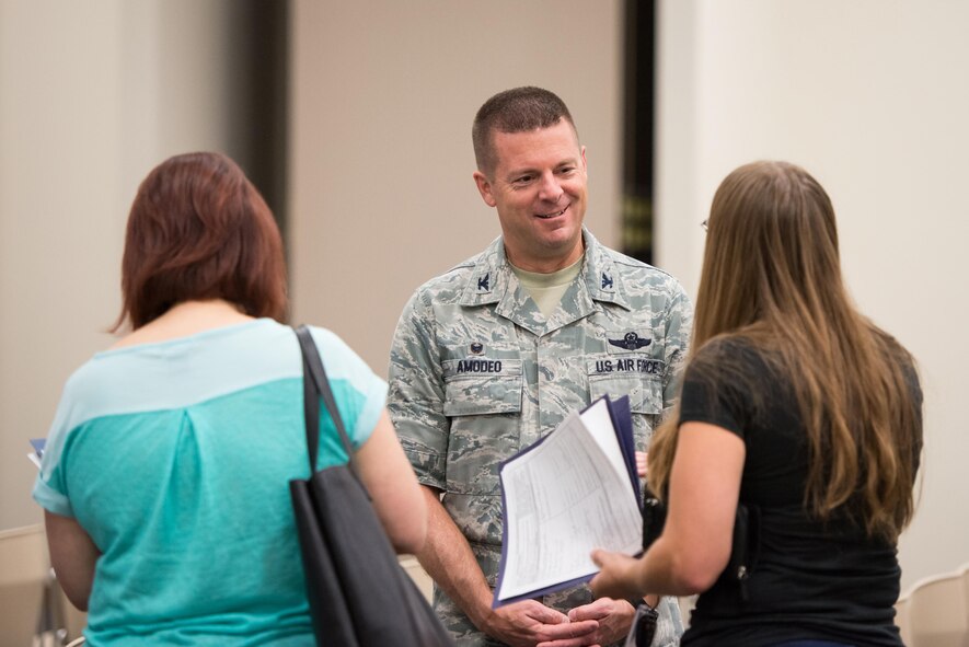 Col. Frank L. Amodeo, 403rd Wing commander, talks to potential recruits during an Inactive Ready Reserve Muster at Keesler Air Force Base, Mississippi, June 11, 2016 to ensure inactive reservists’ readiness. The event recruited 35 Airmen to join the Air Force Reserve and Guard. (U.S. Air Force photo)