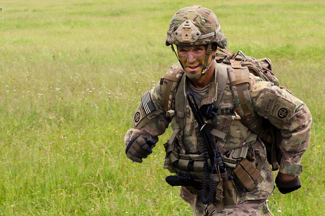 Army Maj. Gen. Richard Clarke, commander, 82nd Airborne Division, rushes off the drop zone after participating in an airborne operation in Hohenfels, Germany, June 15, 2016. Army photo by Sgt. Juan F. Jimenez 


