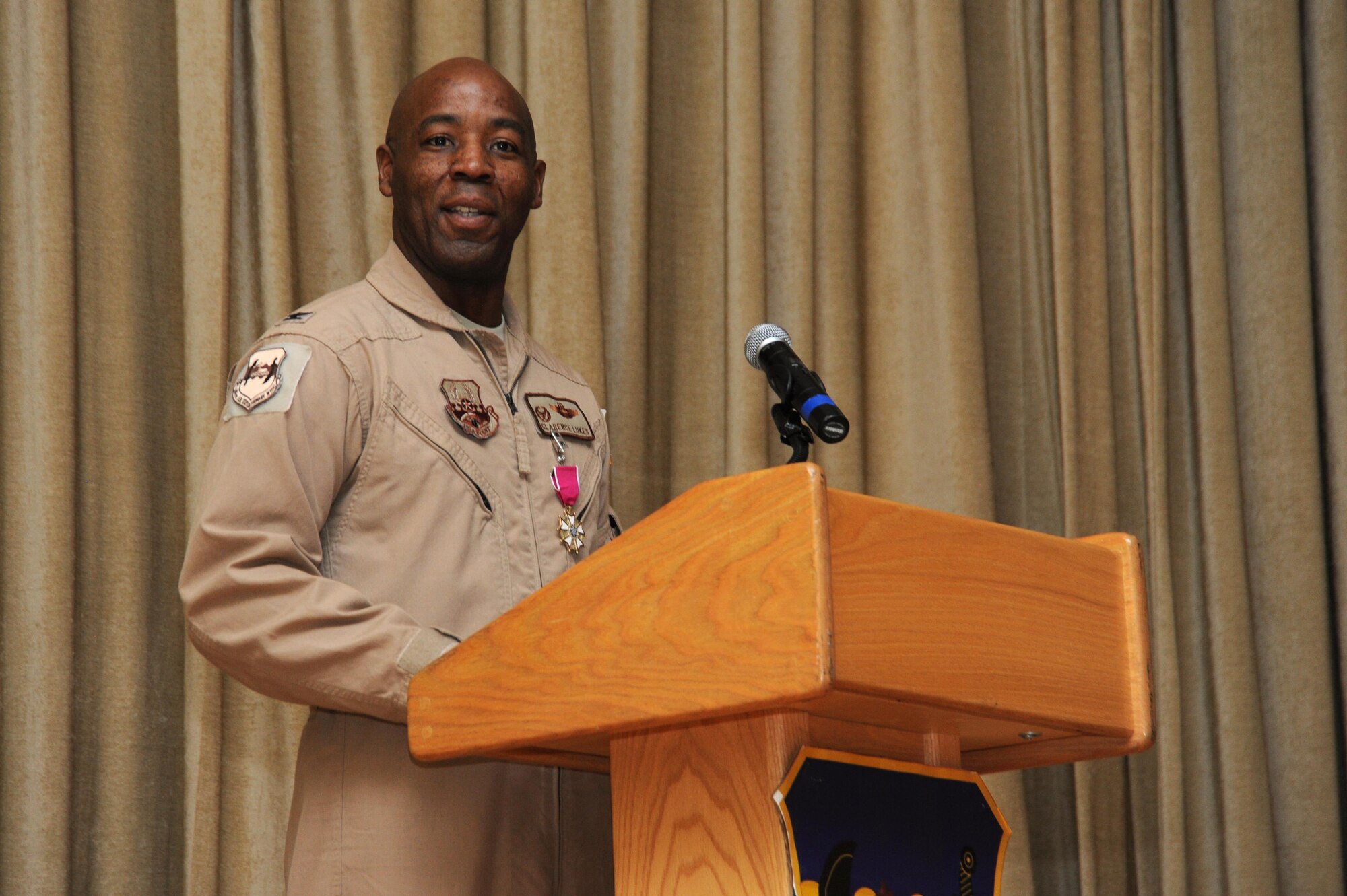 Col. Clarence Lukes Jr., 386th Air Expeditionary Wing outgoing commander, gives his final speech as commander during a change of command ceremony at an undisclosed location in Southwest Asia, June 20, 2016. Lukes led the 386 AEW in support of operations Inherent Resolve and Freedom’s Sentinel since taking command in June 2015. (U.S. Air Force photo by Senior Airman Zachary Kee)