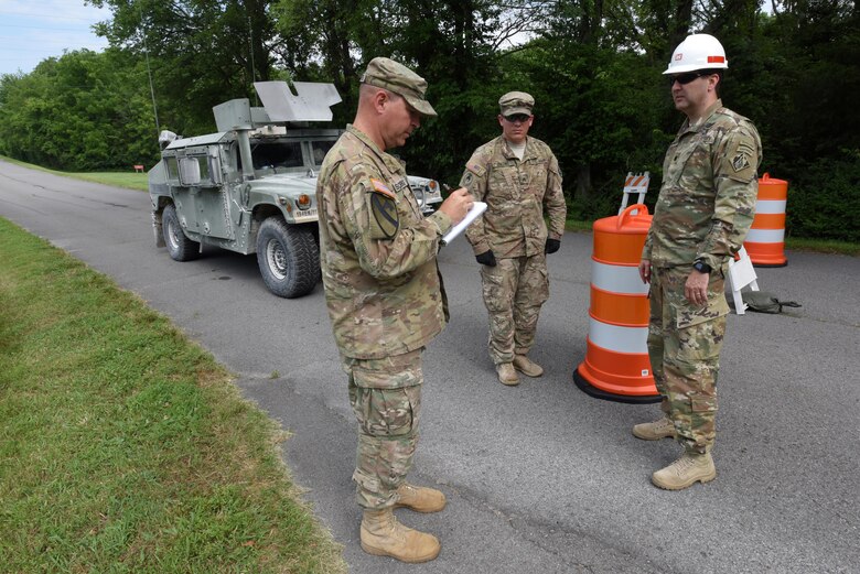 Soldiers with the with the Tennessee National Guard’s 269th Military Police Company, 117th Military Police Battalion, 194th Engineer Brigade, update Lt. Col. Stephen Murphy, U.S. Army Corps of Engineers Nashville District commander, during a security assistance exercise to protect the Old Hickory Dam Powerhouse and Switchyard in Hendersonville, Tenn., June 20, 2016.