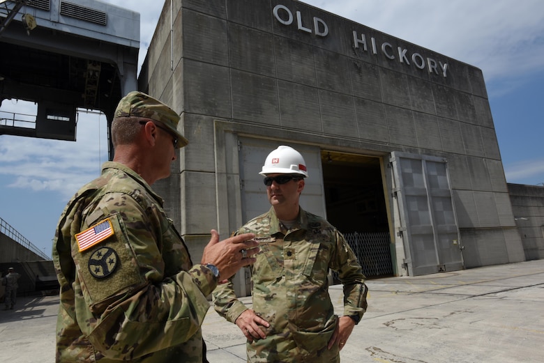 Maj. Gen. Jeffrey H. Holmes, deputy adjutant general for the Tennessee National Guard, and Lt. Col. Stephen Murphy, U.S. Army Corps of Engineers Nashville District commander, confer June 20, 2016 during a security assistance exercise where soldiers set up a perimeter to protect the Old Hickory Dam Power House and switchyard and ensured only authorized personnel gained entry into the facility located in Hendersonville, Tenn.