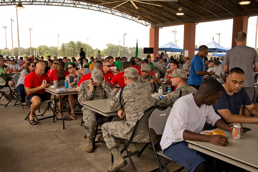 Hungry Airmen, competitors, co-workers and family members enjoy lunch during a break in Team Little Rock’s annual sports day at Little Rock Air Force Base, Ark., June 17, 2016. Servicemembers from the 19th Airlift Wing, 314th Airlift Wing, 913th Airlift Group and the Arkansas Air National Guard’s 189th Airlift Wing, participated in the day-long event as they competed for the commander’s cup and bragging rights. (U.S. Air Force photo by Master Sgt. Jeff Walston/Released) 