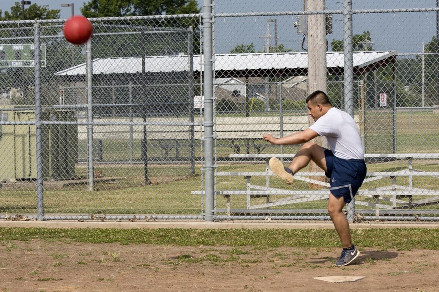 U.S. Air Force Airman 1st Class Chandler Bitterman, crew chief, 19th Maintenance Squadron, attempts to put one over the fence during a Kickball game at Team Little Rock’s annual sports day at Little Rock Air Force Base, Ark., June 17, 2016. Servicemembers from the 19th Airlift Wing, 314th Airlift Wing, 913th Airlift Group and the Arkansas Air National Guard’s 189th Airlift Wing, participated in the day-long event as they competed for the commander’s cup and bragging rights. (U.S. Air Force photo by Master Sgt. Jeff Walston/Released)