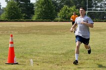 U.S. Air Force Airman 1st Class Jeremiah Long, knowledge management, 19th Communications Squadron, finishes a 100-yard dash during the Strongman Challenge at Team Little Rock’s annual sports day at Little Rock Air Force Base, Ark., June 17, 2016. Servicemembers from the 19th Airlift Wing, 314th Airlift Wing, 913th Airlift Group and the Arkansas Air National Guard’s 189th Airlift Wing, participated in the day-long event as they competed for the commander’s cup and bragging rights. (U.S. Air Force photo by Master Sgt. Jeff Walston/Released) 