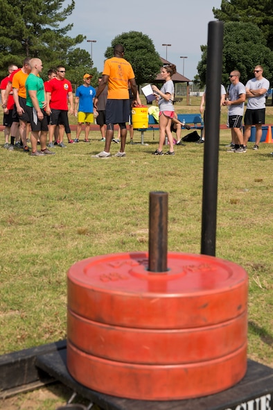 U.S. Air Force Airman 1st Class Kiley Bowling, logistics planner, 19th Logistics Readiness Squadron, explains the rules of the Strongman Challenge during Team Little Rock’s annual sports day at Little Rock Air Force Base, Ark., June 17, 2016. Servicemembers from the 19th Airlift Wing, 314th Airlift Wing, 913th Airlift Group and the Arkansas Air National Guard’s 189th Airlift Wing, participated in the day-long event as they competed for the commander’s cup and bragging rights. (U.S. Air Force photo by Master Sgt. Jeff Walston/Released) 
