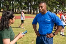 U.S. Air Force Senior Airman Mercedes Taylor, photojournalist, 19th Airlift Wing, interviews U.S. Air Force Reserve Staff Sgt. Marquice Combs, program manager, Development Training Flight, 913th Airlift Group, during Team Little Rock’s annual sports day at Little Rock Air Force Base, Ark., June 17, 2016. Servicemembers from the 19th Airlift Wing, 314th Airlift Wing, 913th Airlift Group and the Arkansas Air National Guard’s 189th Airlift Wing, participated in the day-long event as they competed for the commander’s cup and bragging rights. (U.S. Air Force photo by Master Sgt. Jeff Walston/Released) 
