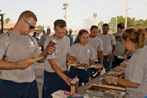 Volunteers serve lunch during Team Little Rock’s annual sports day at Little Rock Air Force Base, Ark., June 17, 2016. Servicemembers from the 19th Airlift Wing, 314th Airlift Wing, 913th Airlift Group and the Arkansas Air National Guard’s 189th Airlift Wing, participated in the day-long event as they competed for the commander’s cup and bragging rights. (U.S. Air Force photo by Master Sgt. Jeff Walston/Released) 


