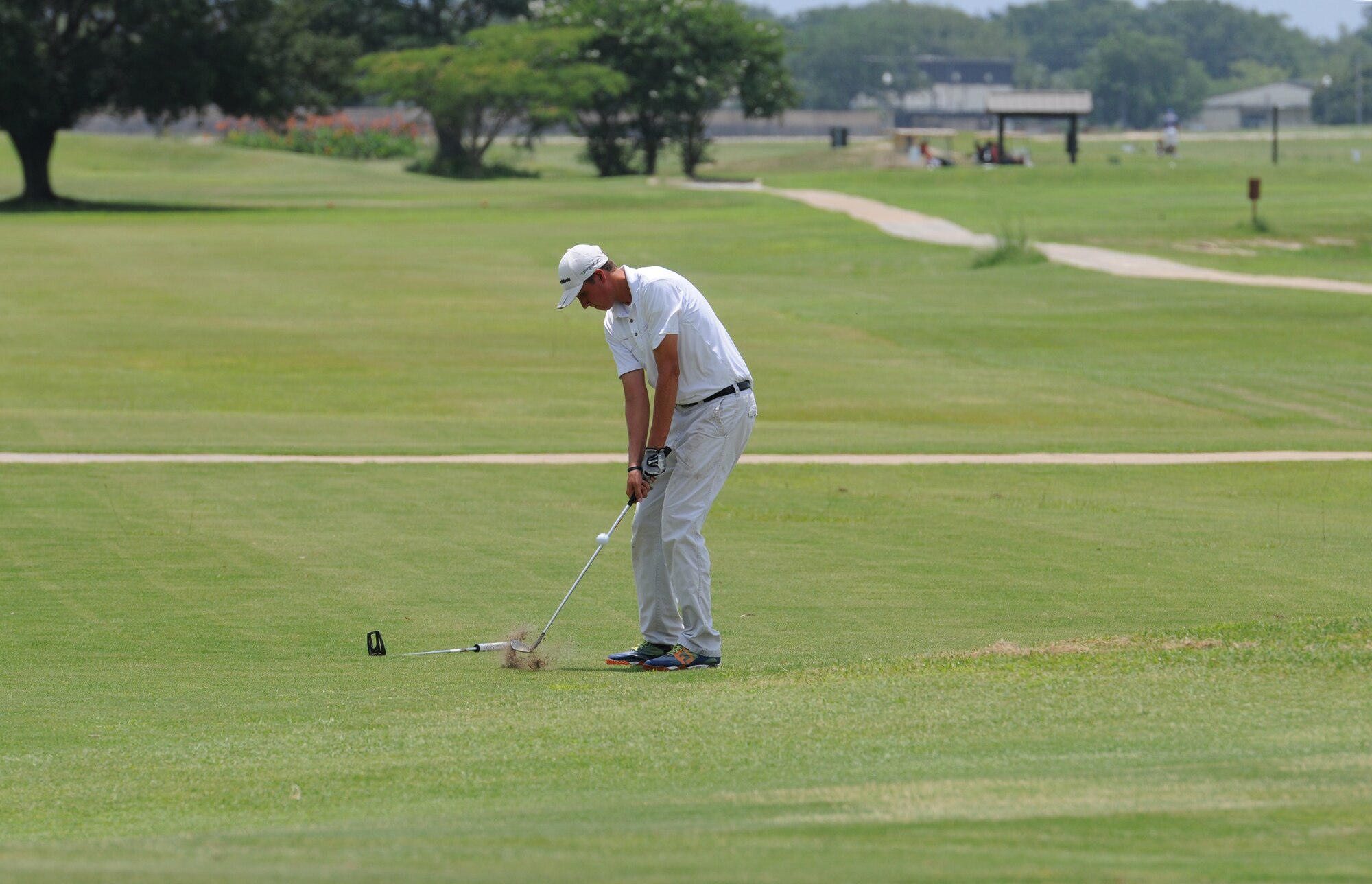 Jacob McClish, 81st Force Support Squadron recreation aid, takes a swing on hole #10 during the Don Wylie Memorial Golf Tournament at the Bay Breeze Golf Course June 17, 2016, Keesler Air Force Base, Miss. The annual tournament raised funds to help the Military & Veterans Affairs committee honor military members. (U.S. Air Force photo by Kemberly Groue)