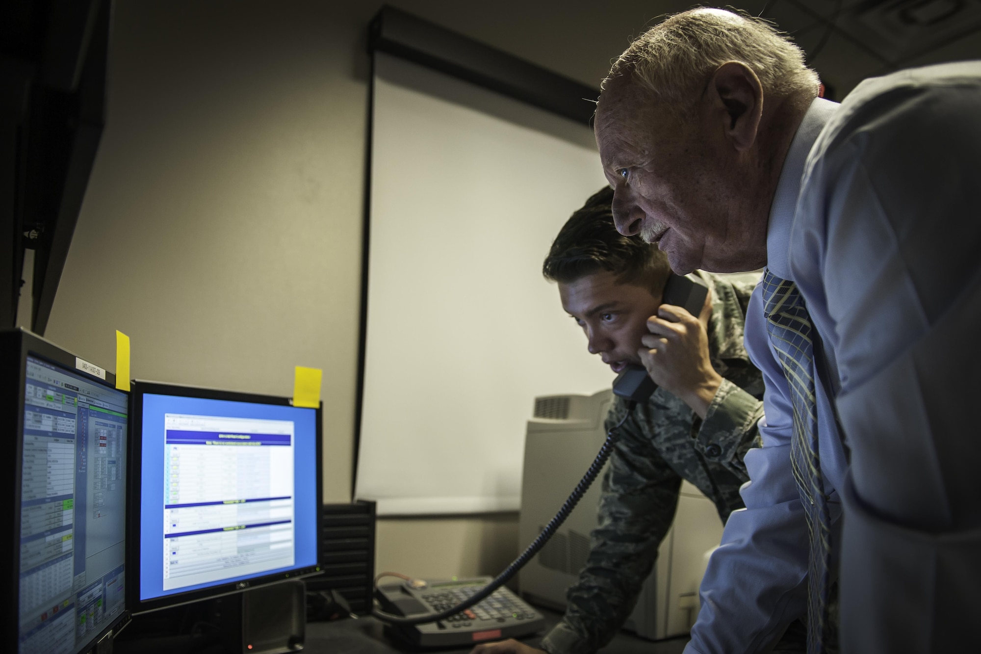 Contractor Jim Brewer and Senior Airman Guillermo Delacruz-Martinez, 2nd Space Operations Squadron, send the disposal command to GPS Satellite Vehicle No. 35 at Schriever Air Force Base, Colorado, Friday, June 10, 2016. The command marked the vehicle’s end of life. (U.S. Air Force Photo/Dennis Rogers)