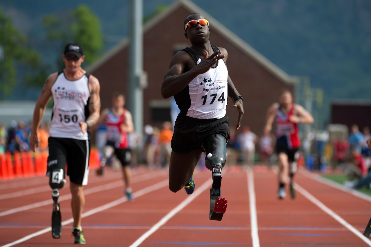 Army Capt. William Reynolds crosses the finish line first in the men’s 100-meter dash of the 2016 Department of Defense Warrior Games at the U.S. Military Academy in West Point, N.Y., June 16, 2016. DoD photo by EJ Hersom