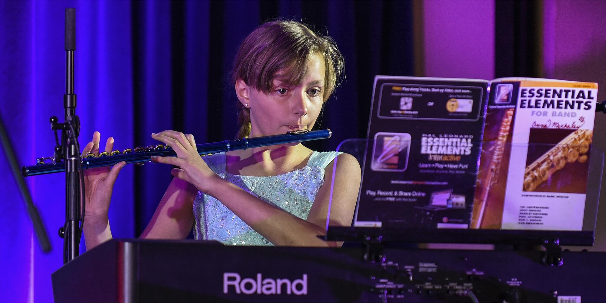 PETERSON AIR FORCE BASE, Colo. – Anna Mechaley performs the song “Ode to Joy” on the flute during the Peterson’s Got Talent competition at The Club on Peterson Air Force Base, Colo., June 14, 2016. Mechaley is currently learning to play the flute and performed before an audience and two judges. (U.S. Air Force Photo by Craig Denton)