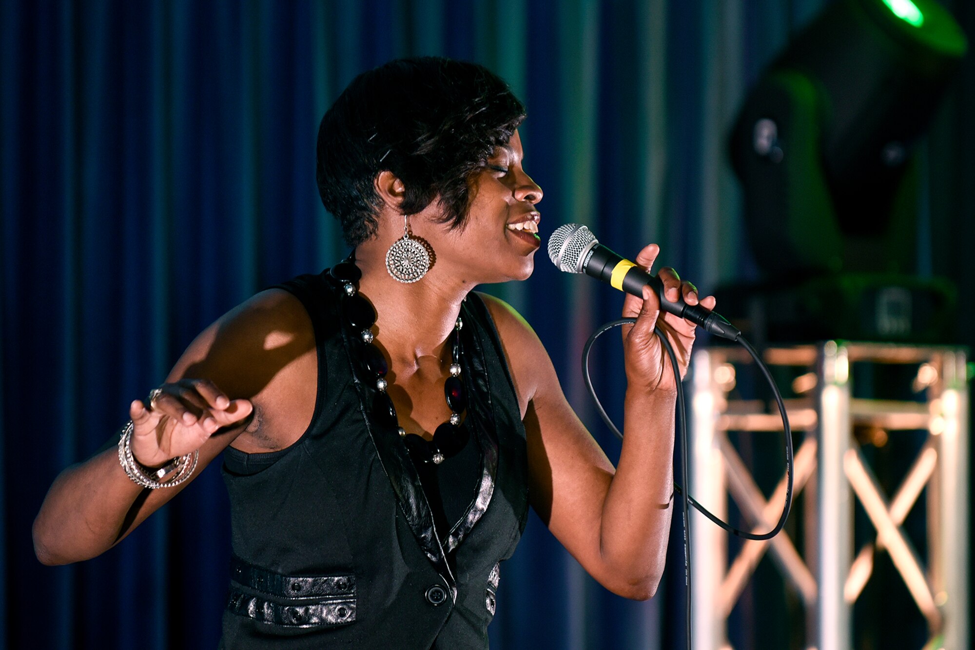 PETERSON AIR FORCE BASE, Colo. – Tech. Sgt. Katrena Holmes, 21st Medical Squadron sings “Stitches” by Shawn Mendes during the Peterson’s Got Talent competition at The Club on Peterson Air Force Base, Colo., June 14, 2016. Katrena was one of 12 individuals to perform at this year’s completion. (U.S. Air Force Photo by Craig Denton)