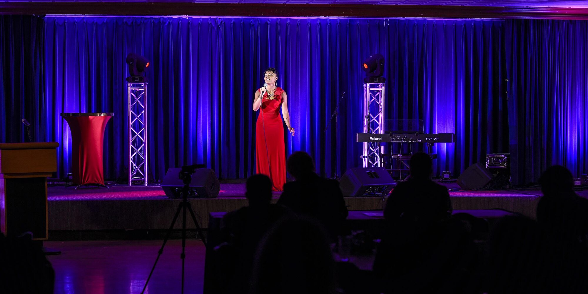 PETERSON AIR FORCE BASE, Colo. – Senior Airman Angel Turner, 21st Medical Support Squadron sings before a live audience and two judges during the Peterson’s Got Talent competition at The Club on Peterson Air Force Base, Colo, June 14, 2016. Turner won first place for the Airmen category and was presented a trophy and certificate by Col. Doug Schiess, 21st Space Wing commander and Chief Master Sgt. Idalia Peele, 21st Space Wing command chief master sergeant. (U.S. Air Force Photo by Craig Denton)
